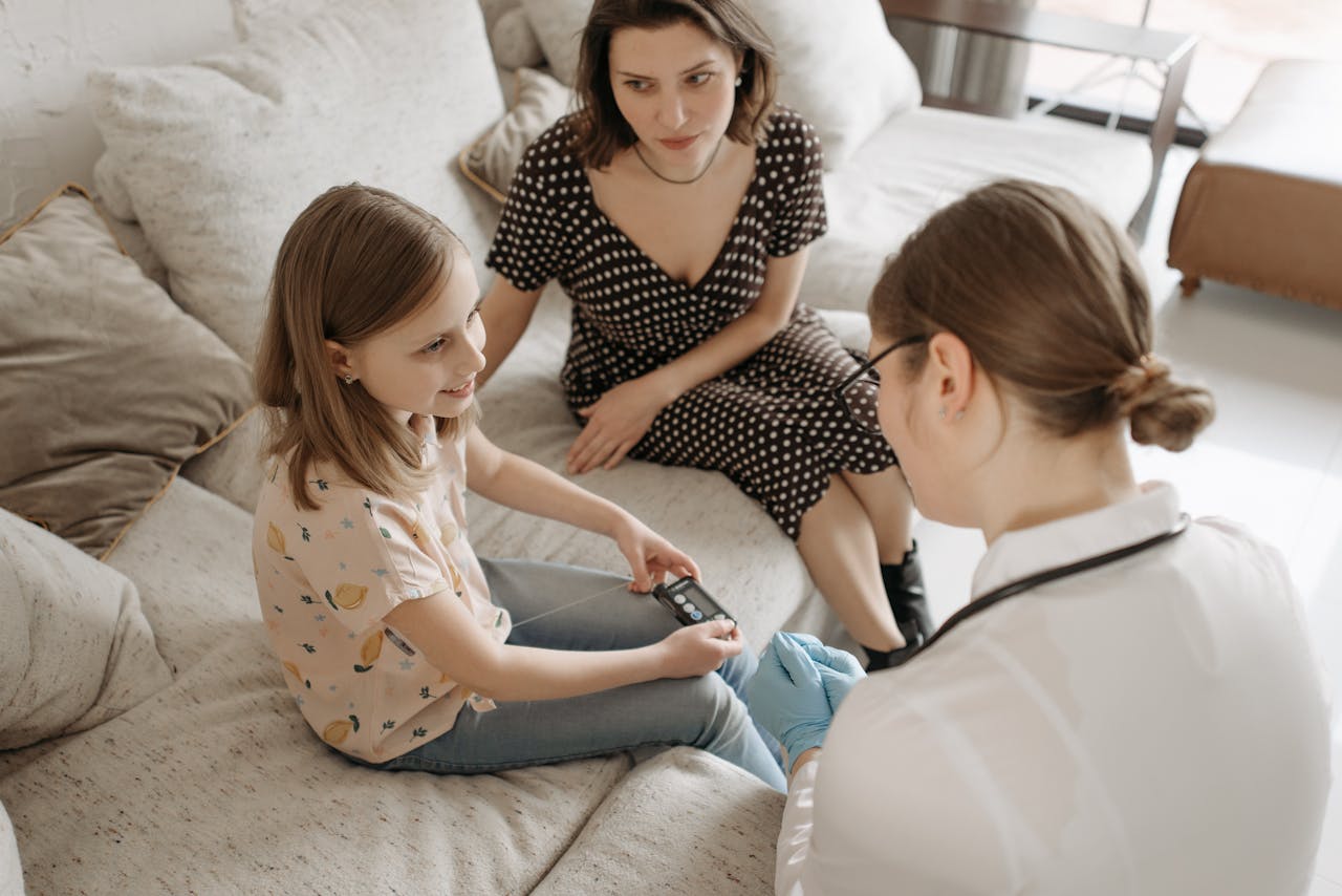 The Art of Drawing Readers In: Your attractive post title goes here A healthcare provider assists a child with a diabetes check-up at home.